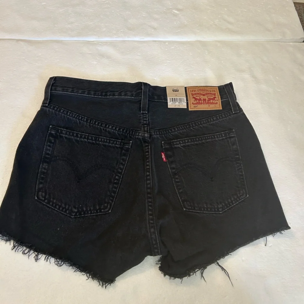 Levi’s NWT black 501 original fit high rise distressed black denim jean shorts
